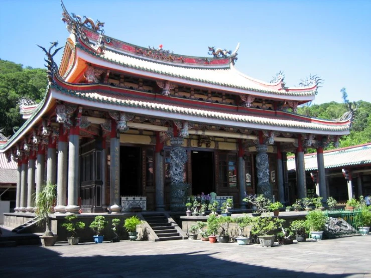 this is a chinese building with trees in the background