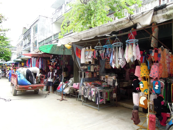 a view of people shopping in an outdoor market