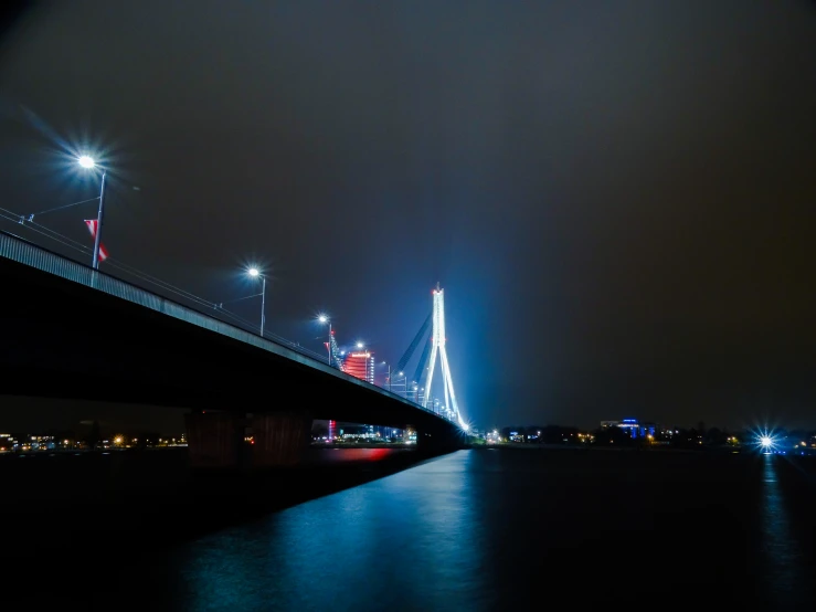 a very long bridge in the middle of the night