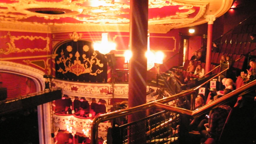 the stairs of the victorian theater are lit up by candle lamps