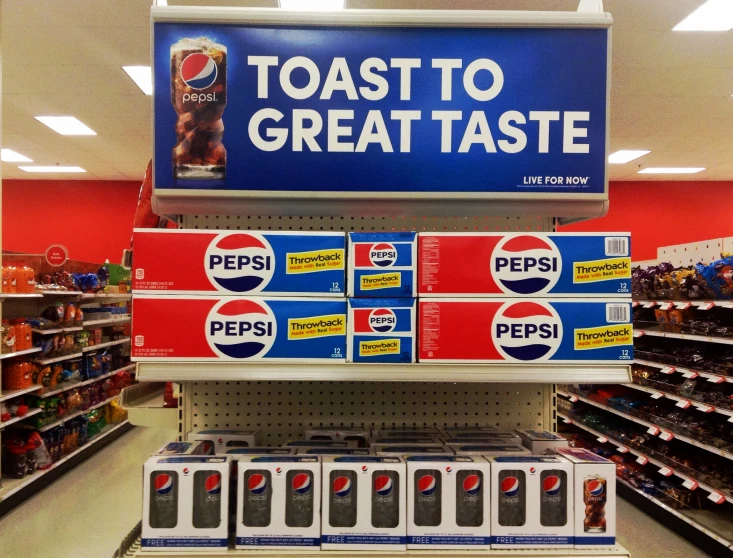 a store shelf with pepsi products for sale