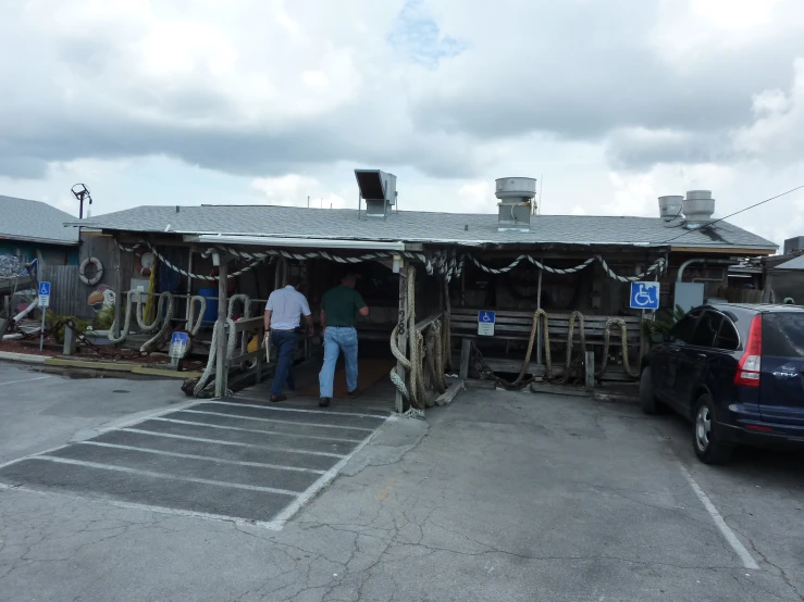 two people standing at the entrance to a business