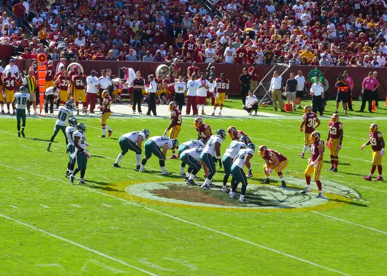 a football game with players in the middle of the field