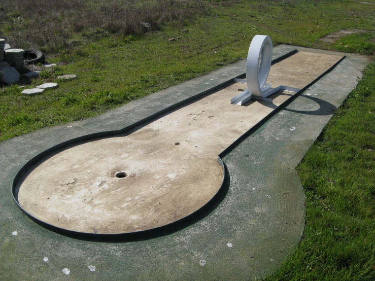 the monument has a large oval object like sculpture