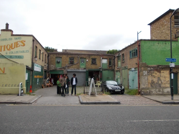 a group of people walking out of a building