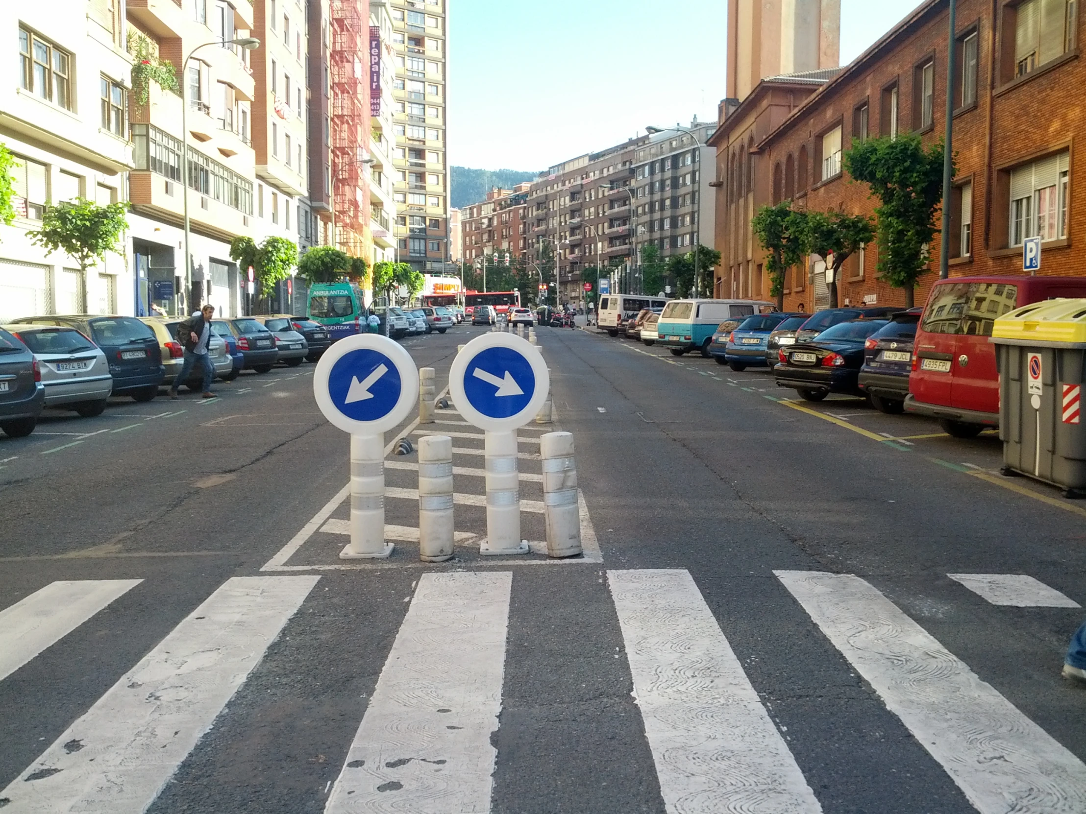 street signs on city roadway in urban setting