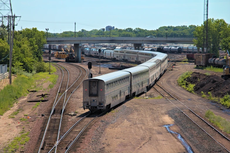 a train sits at the edge of a track near water