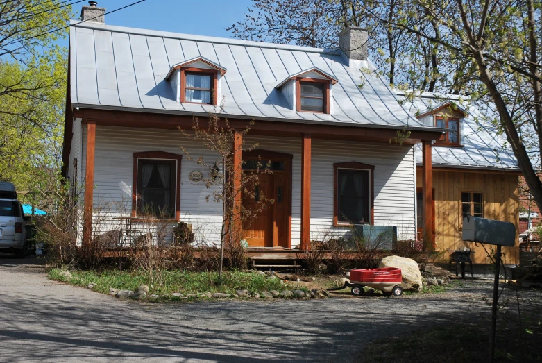 the home is white with a metal roof