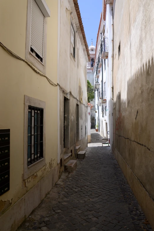 an alley with old buildings on both sides