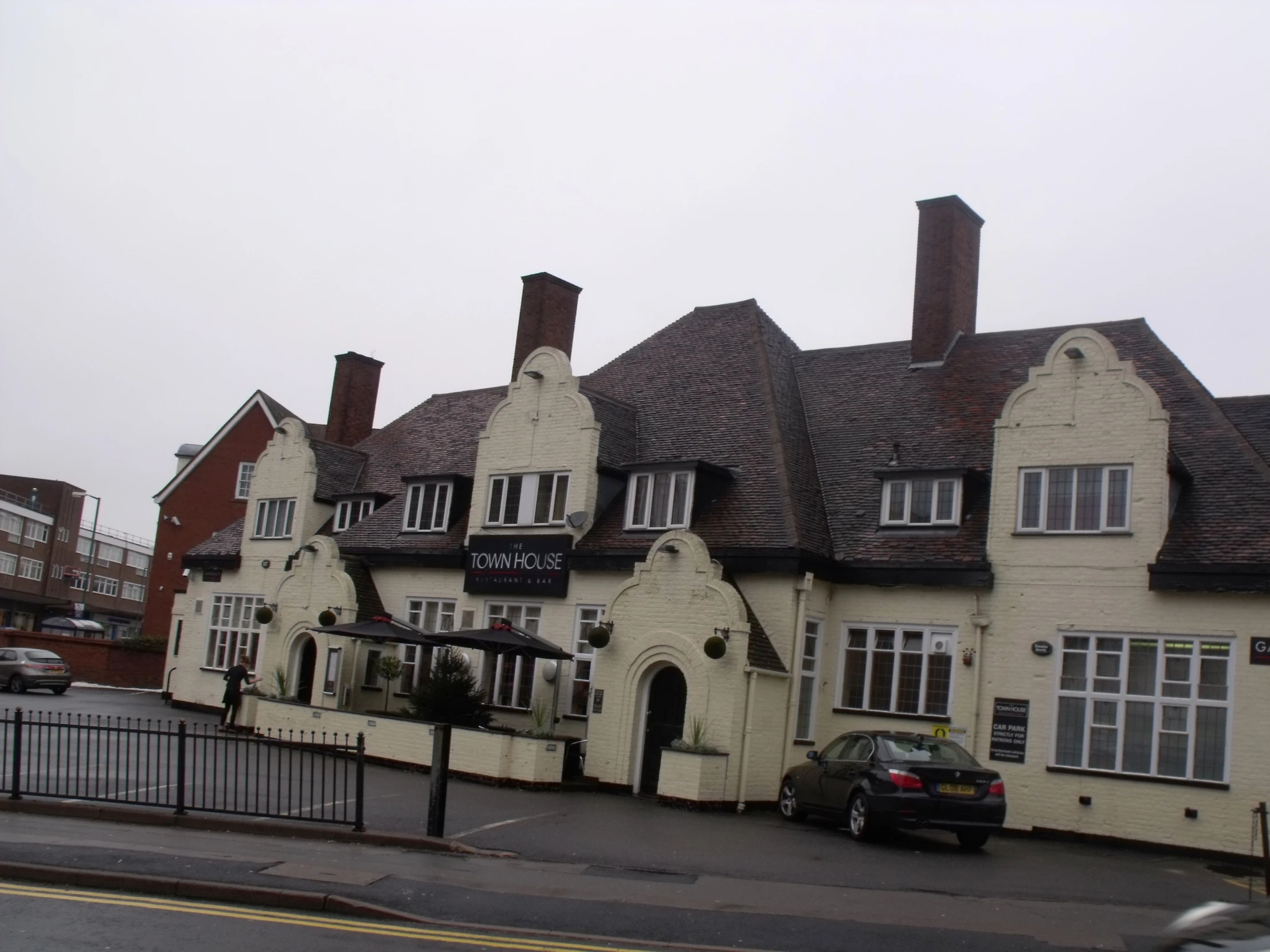 the white building is a restaurant and tavern