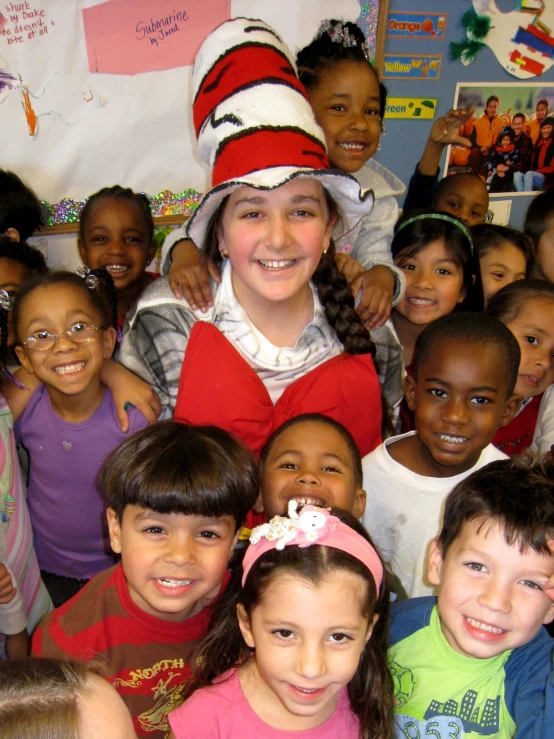 a group of s smile in a class room