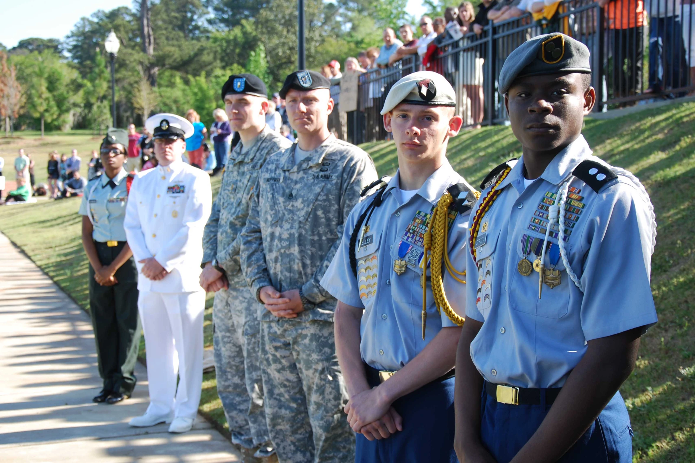 a group of uniformed military officers standing next to each other