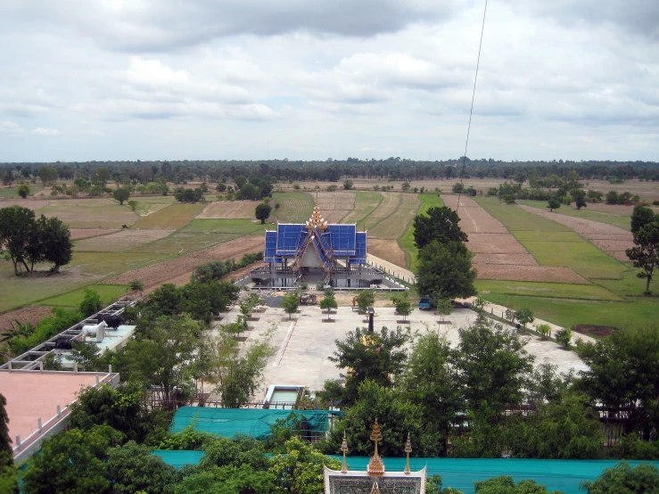 an aerial view of a small city, with a large construction site