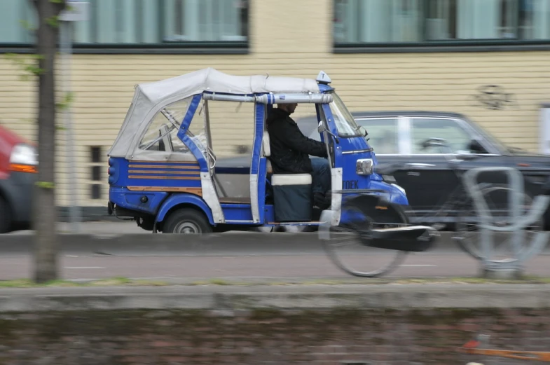 a person driving a cart on the street