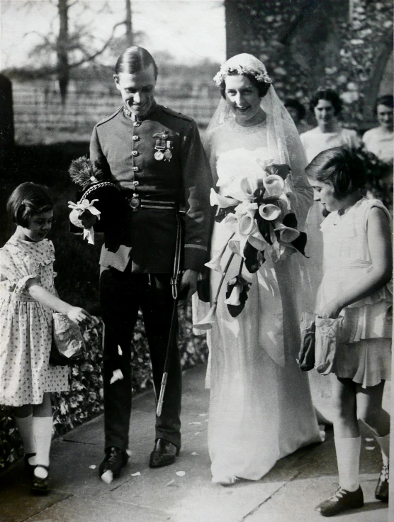 a young child standing next to an older man and woman