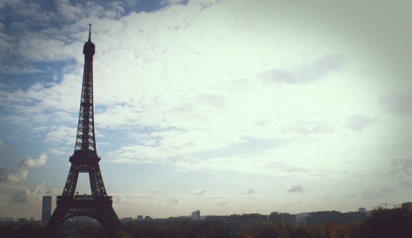 the eiffel tower against a blue sky