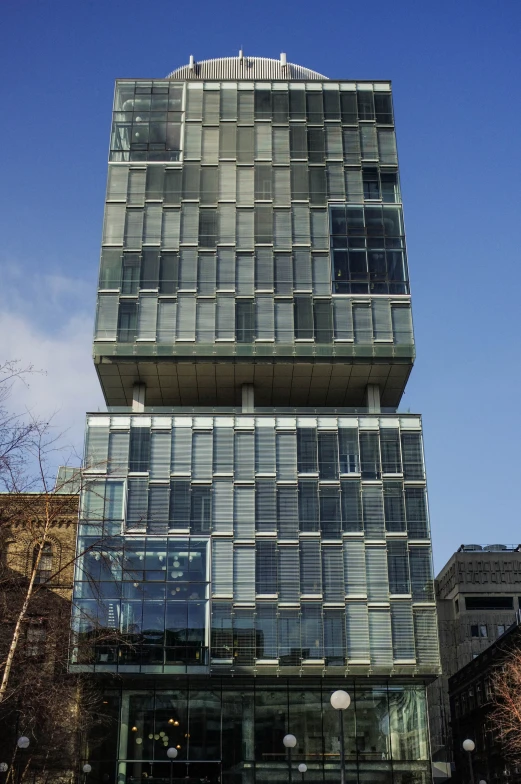 a tall, shiny building with a lot of windows