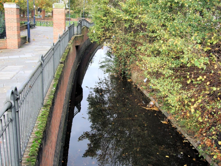 a small water source is seen on this road