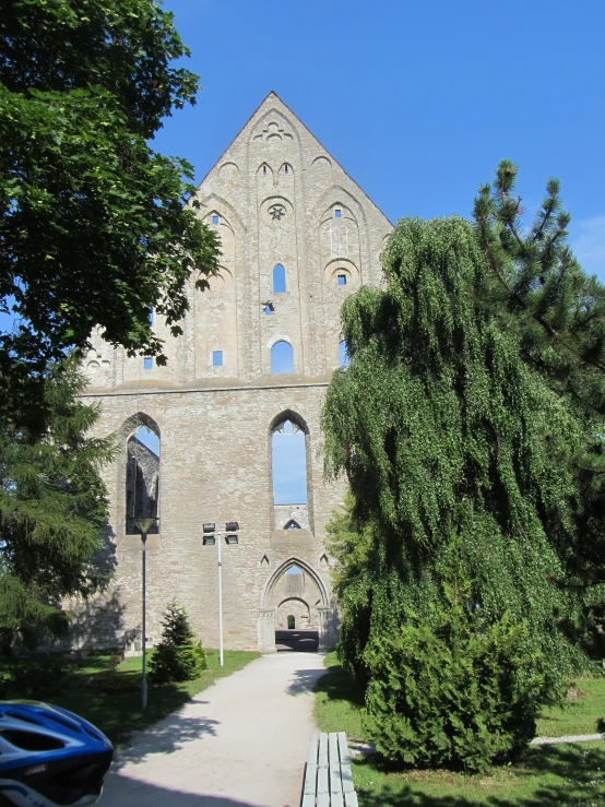 an old stone church with large arched windows