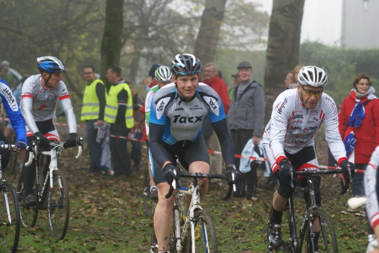 the men are racing in a bike race