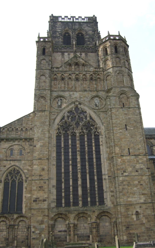 the large church building has several steeples and elaborate windows