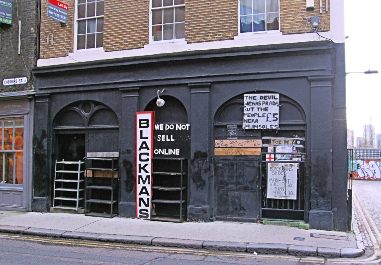 some signs are placed at the door of a building