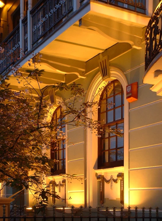 a white building with lots of windows and railing