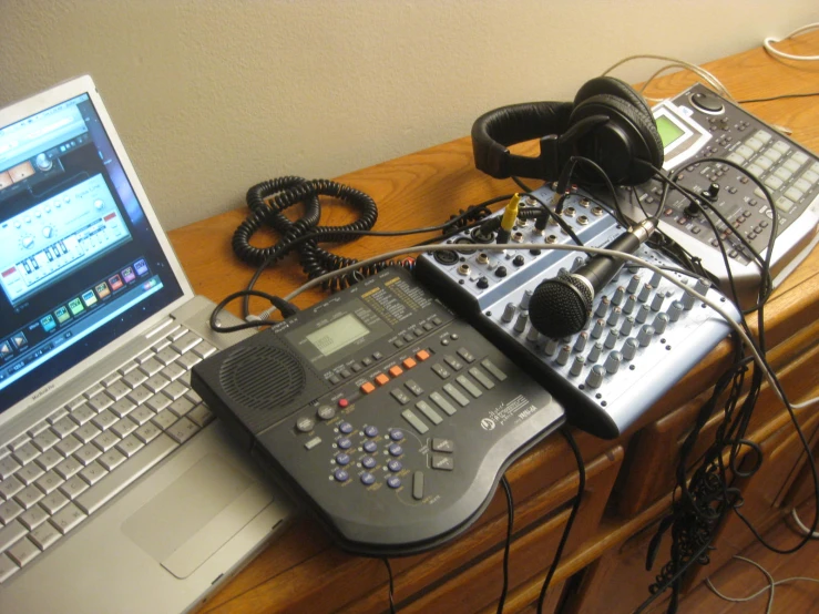 a radio set up on a laptop with headphones on the keyboard