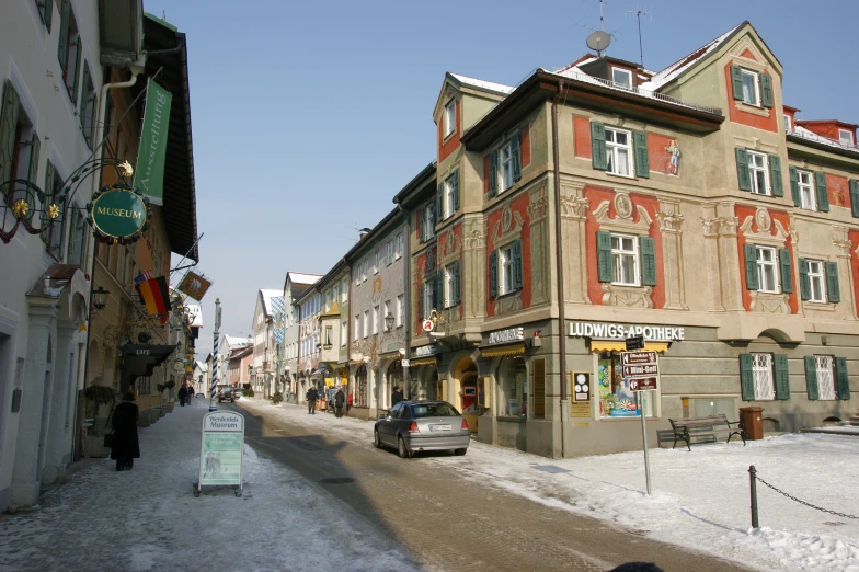 several shops line a street in an old town