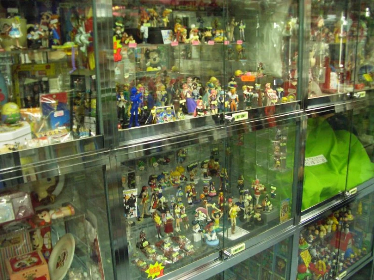 a glass case filled with lots of different types of action figures