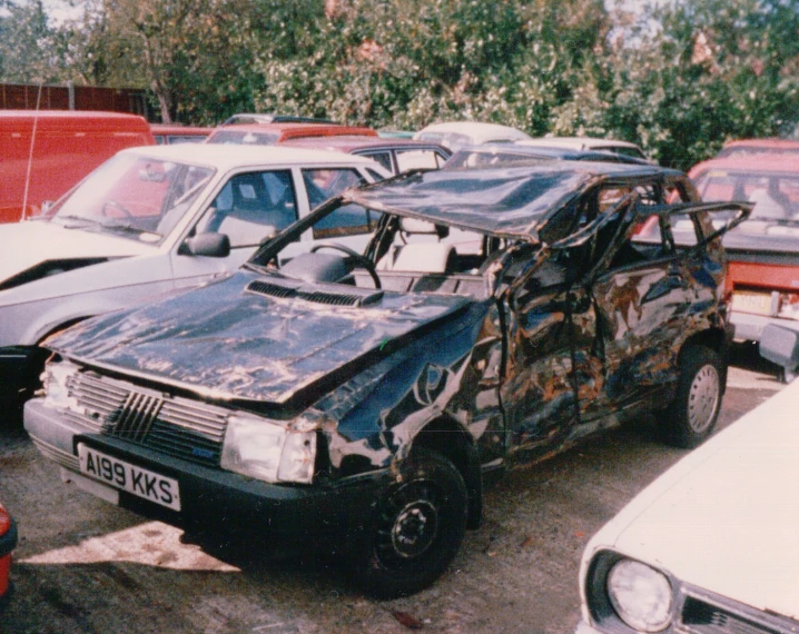 a car that has just been abandoned in a lot