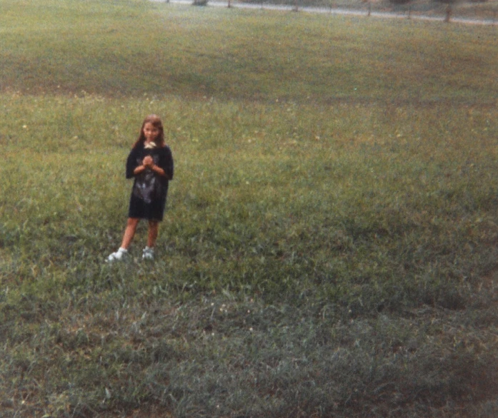 a small  standing in the middle of an open field