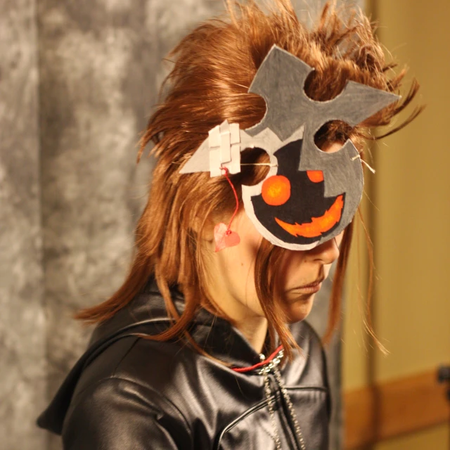 a woman with red hair wearing an unusual costume