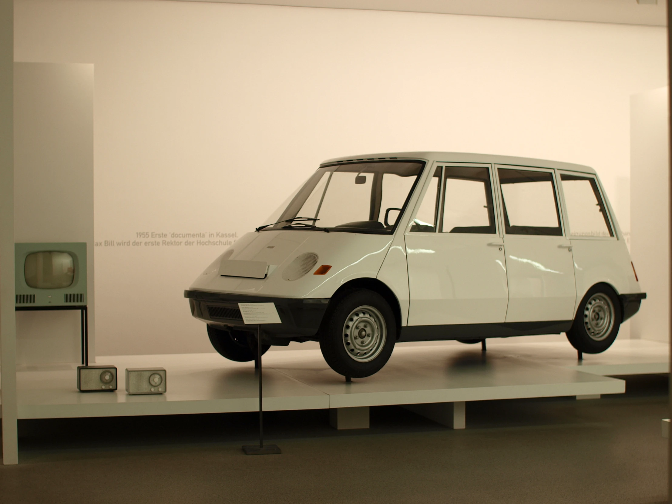 an older vehicle on display in a museum exhibit