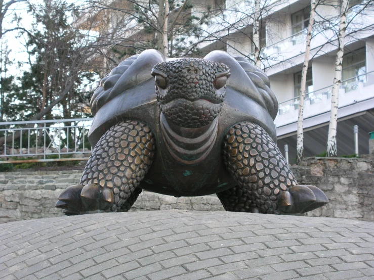 a large statue sitting on top of cement