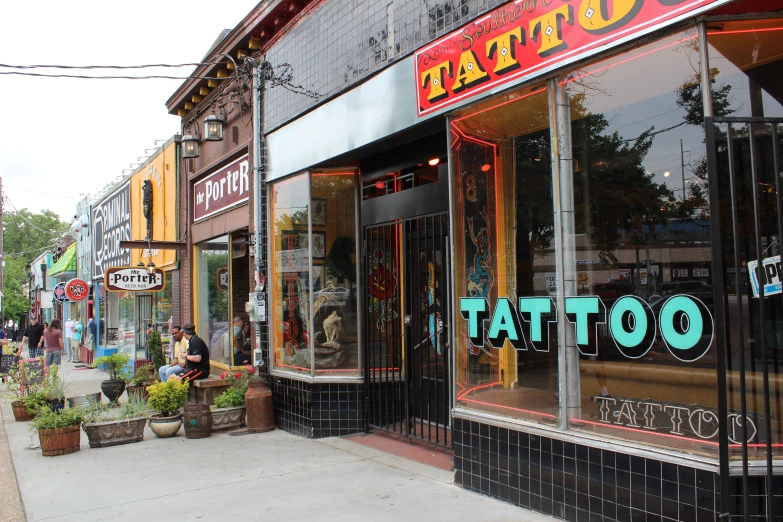 a tattoo shop located on a street corner
