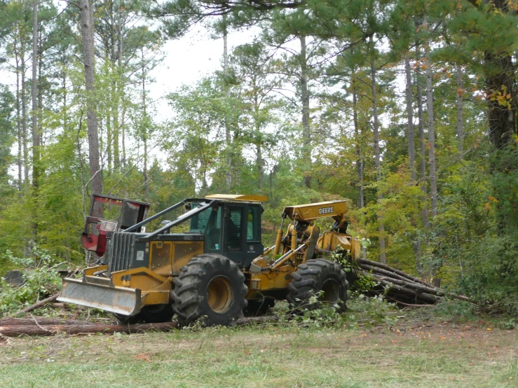 a tractor that is sitting in the grass