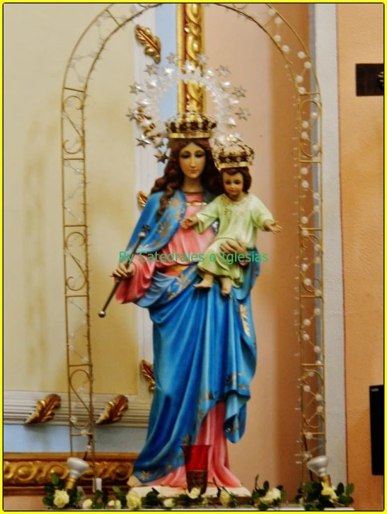a statue of the mother mary holding baby jesus