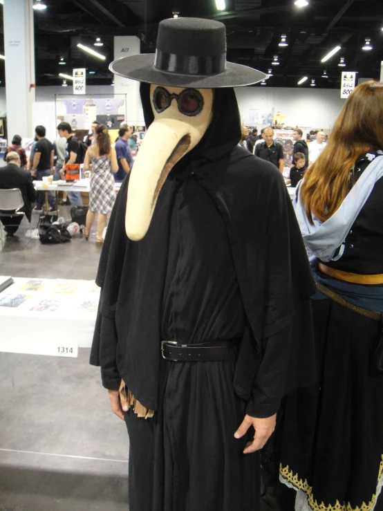 a person with a mask and hat on