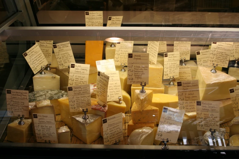 some yellow and white cheese notes and bottles