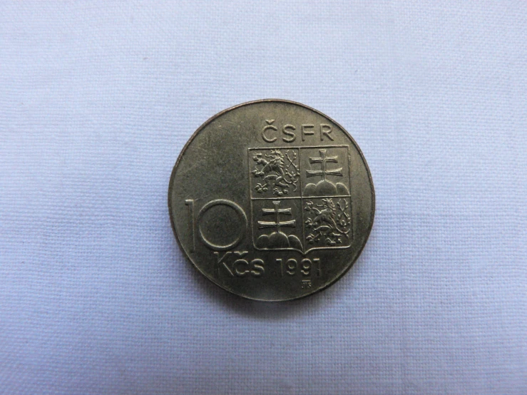 there is a coin with many other things on it