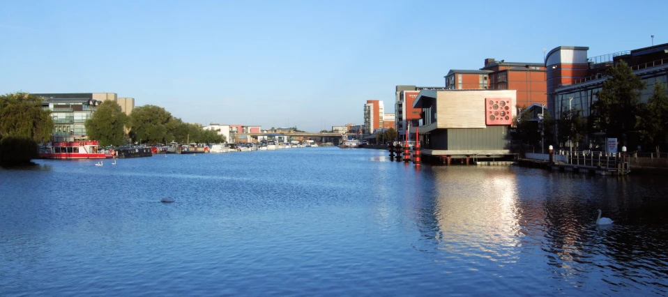 a body of water surrounded by brick buildings
