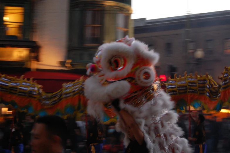 an asian lion dance with a blurred background