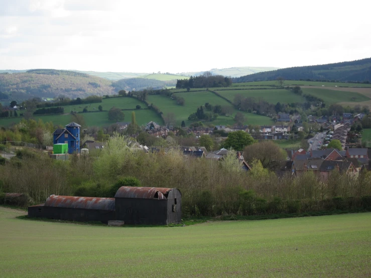 a picture of a rural countryside with buildings