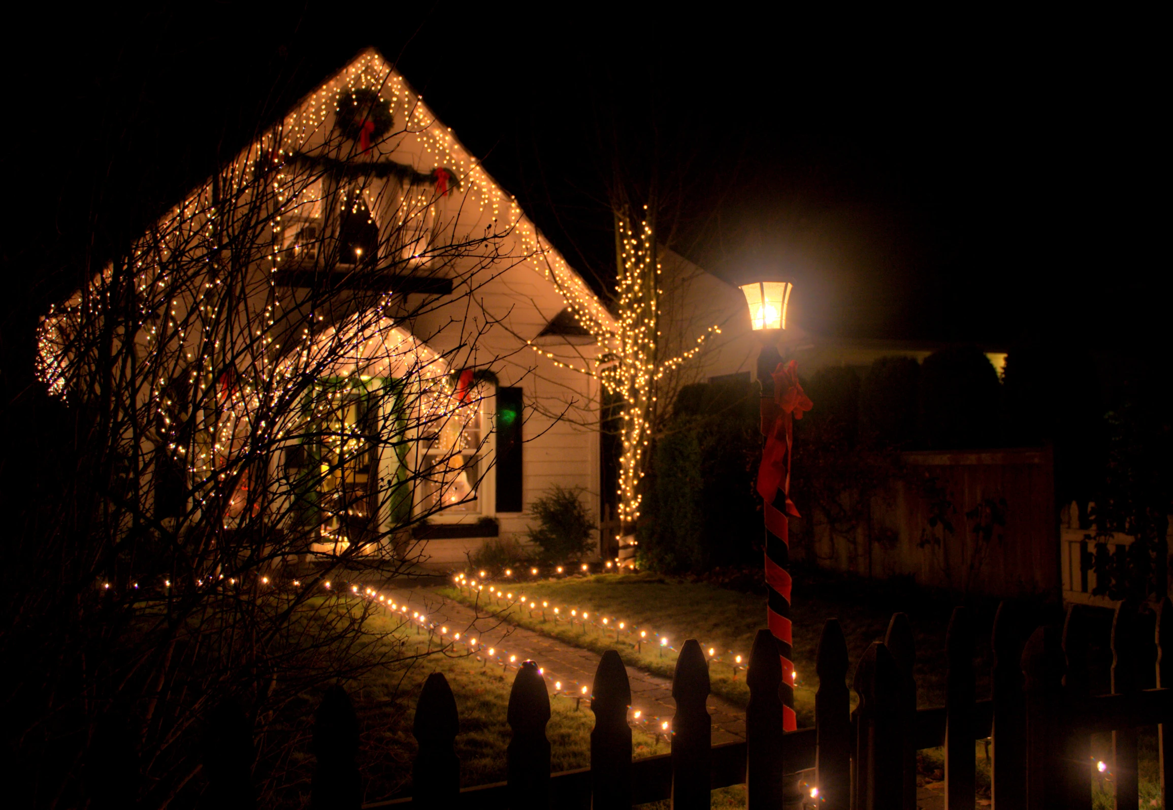 there is a house lit up with christmas lights