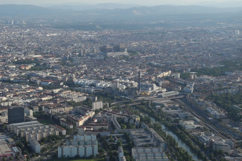 a view of a city with cars and trees