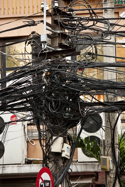 some wires in the middle of some buildings
