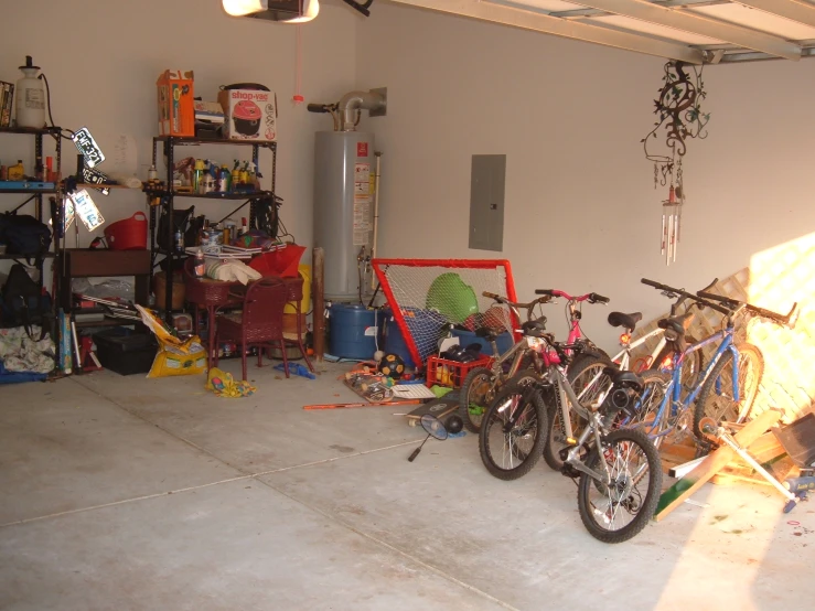 there are three bicycles that are standing on the floor