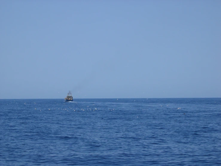 a small boat out on the open ocean