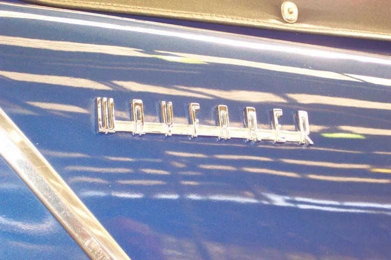 close up of the logo on the grille of a car